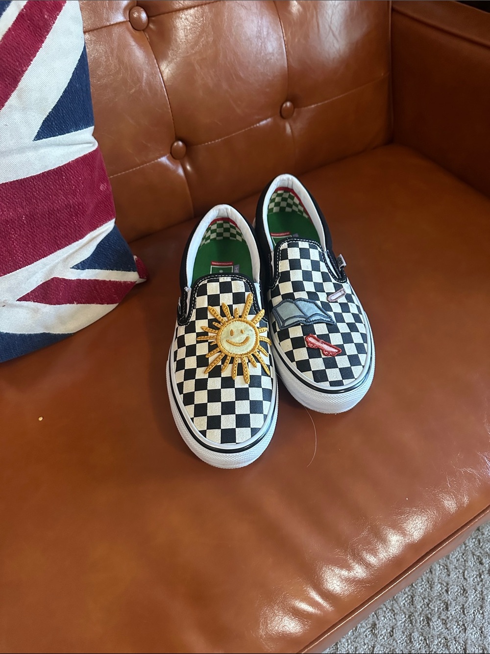Black & White Checkerboard Slip-On Sneakers with Sun Patch skateistan